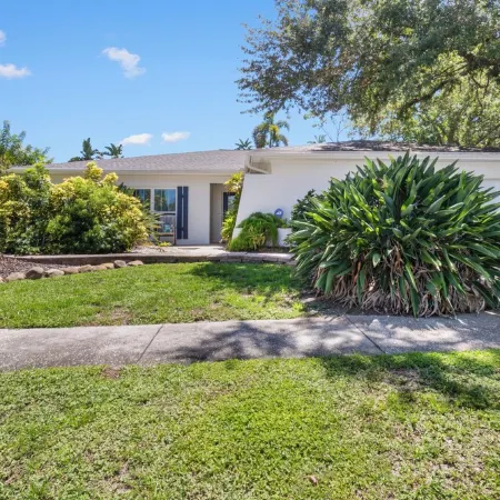 This beauty is centrally located,  with a heated pool and water fall!