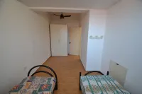 Villetta Gianira con giardino ombreggiato e climatizzatore Pt58