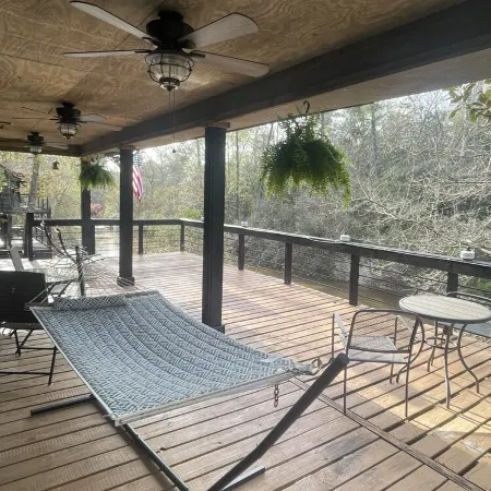 Creek-side getaway, big deck, easy access to the city while being off the grid!