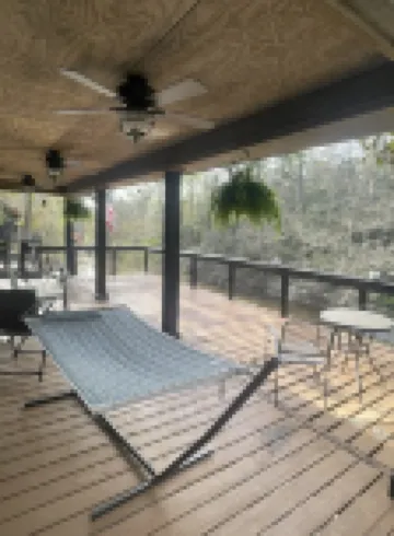 Creek-side getaway, big deck, easy access to the city while being off the grid!