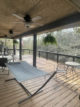 Creek-side getaway, big deck, easy access to the city while being off the grid!