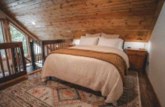 Mid-century modern cowboy retreat with a 35-ft. deck on the Salmon River.