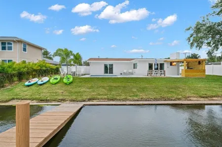 Walk to beach, riverfront, pool home. Bring your boat!