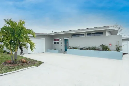 Escape and get tropical at Belle's Tropic Spot...YACHT Club Beach neighborhood!