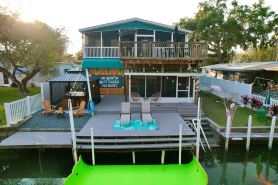 River Home with Huge Arcade, Hot Tub, Kayaks, Mini Golf Course, 80in TV