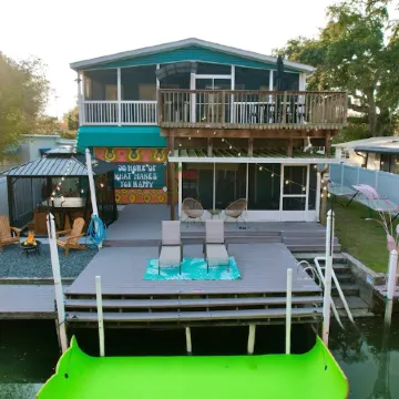 River Home with Huge Arcade, Hot Tub, Kayaks, Mini Golf Course, 80in TV
