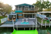 River Home with Huge Arcade, Hot Tub, Kayaks, Mini Golf Course, 80in TV - Boutique