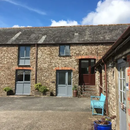 Barn conversion overlooking the golf course to the sea