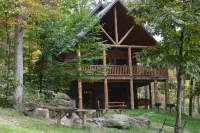 Secluded 3-bedroom cabin on 42 wooded acres with fishing pond, AC, WiFi