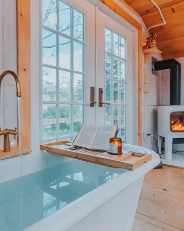 Treehouse lifted up over a stocked trout pond up in the beautiful birch trees!