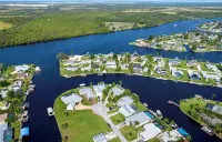 Raised home right on the Caloosahatchee River. Come enjoy the water and weather
