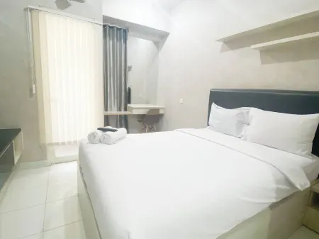 Elegant and Homey Studio at Amartha View Apartment Отели в г. Ngaliyan