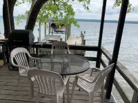 Waterfront retreat on 7 private wooded acres with beautiful sunset views.