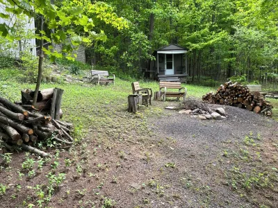 Waterfront retreat on 7 private wooded acres with beautiful sunset views.
