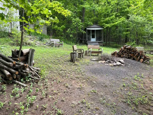 Waterfront retreat on 7 private wooded acres with beautiful sunset views.