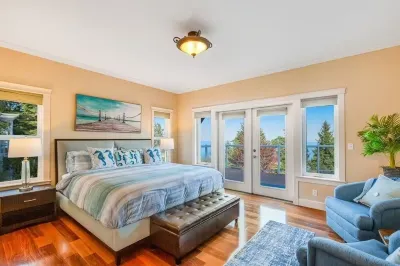 Custom estate with 6 bedrooms, 4+baths, private beach in enchanting Coupeville.