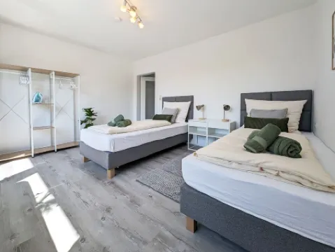 Modern vacation apartment near the center/train station with WiFi & parking space