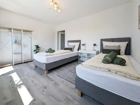 Modern vacation apartment near the center/train station with WiFi & parking space