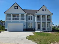 Beautiful two-story single family beach home with a private pool and ocean views