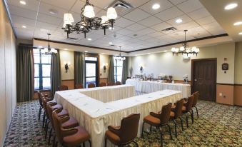 a large conference room with multiple tables and chairs arranged for a meeting or event at The Appalachian at Mountain Creek
