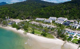 aerial view of a resort on the beach , featuring multiple buildings and a sandy shoreline at Banyan Tree Krabi