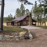 Two story authentic log construction home, built in 1936 with two fireplaces.