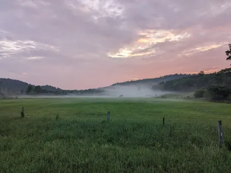 Private tent camping along the Salmon River on 165-acre Farm.