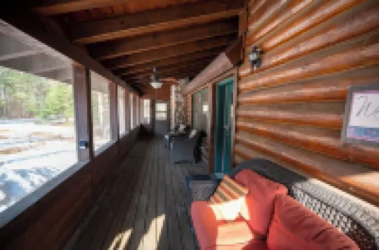 Exceptional log home on 9+ acres with frontage on Big St. Germain Lake