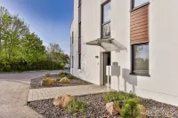 Modern apartment with stunning views of the water and the Rügen Bridge - Homestays