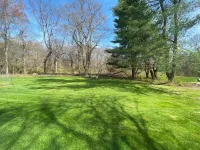 Lovely home near beaches. Ample yard with patio with enclosed porch & hot tub.