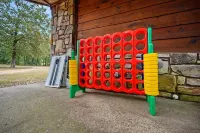 Secluded 4 bedroom farmhouse nestled on 8 acres with large lawn and oak trees.