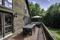 Secluded modern log cabin with picturesque private water fall on 12 acres!
