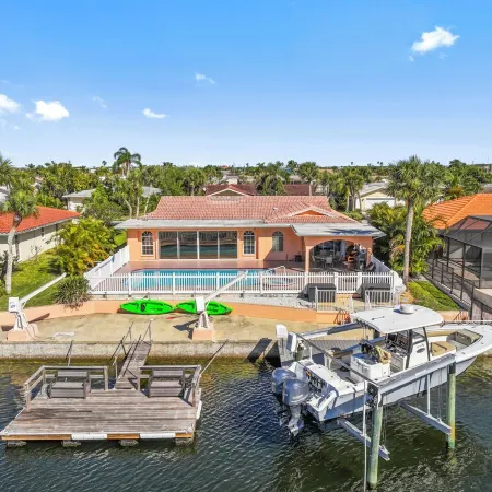 Water Front Home with Heated Pool & Hot Tub, 2 Master Suites & a Floating Dock.