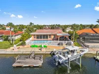 Water Front Home with Heated Pool & Hot Tub, 2 Master Suites & a Floating Dock.