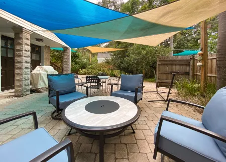 Chic Coastal Escape with Tropical Patio - Charming Beach Haven