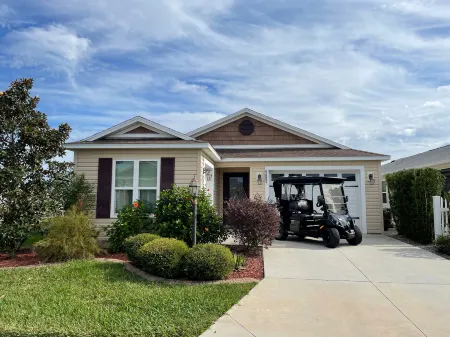 Charming Corner Lot with Golf Cart and Screened Lanai - Inviting Escape