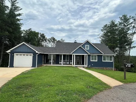 Non-smoking lake house with private beach, dock and kayaks