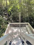 Relaxing round home with a river centrally located