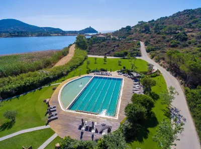 Baia Chia Laguna Resort, Curio Collection by Hilton