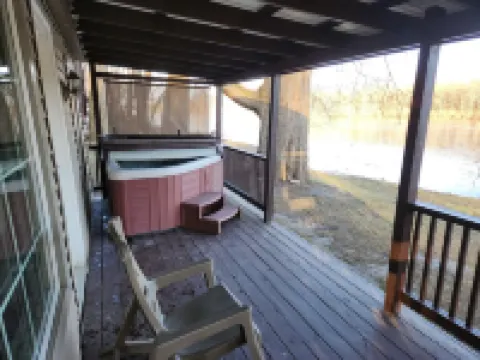 Riverfront Cottage with Hot Tub, Kayaks, Canoes, & Fishing Boats!