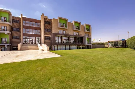 Dhara Residence E2 Lodge Hotel Отели рядом с достопримечательностью «Университет Октобер 6»