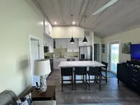 Ocean view & Golf cart included!  Sports fans don’t miss any games pro or NCAA!