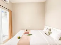Cream Tone 1BR at Royal Sentul Park Apartment By Travelio