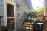 Covered parking/3 bedrooms, sitting room, restroom w/laundry, full kitchen, deck