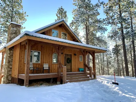 Nestled-in-pines, sooth-your-soul custom home with an incredible mountain view.
