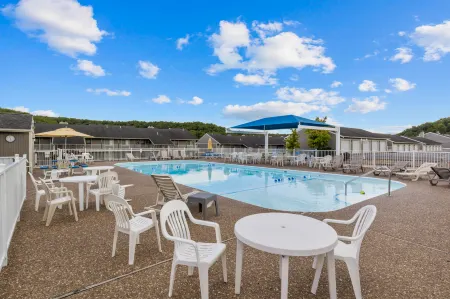 Cozy Condo with Rock Fireplace and Pool - Gorgeous Waterfront Oasis