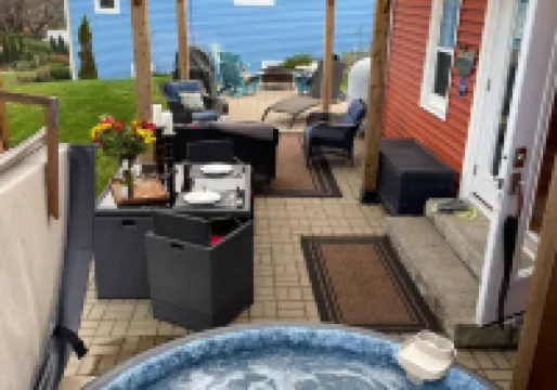 Relax on the South Shore, steps from 2 beaches, ocean views & hot tub.