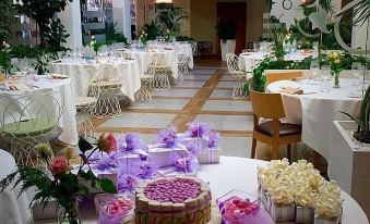 a wedding reception with multiple tables and chairs , where guests are seated and enjoying the festivities at Hotel Monteverde