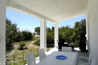 Villa at 20 m. from the sea on the beautiful and unspoiled beach of Carratois