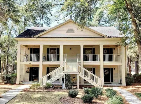 Spacious condo on Jack Nicklaus Signature Golf Course overlooking 10th Tee Box.